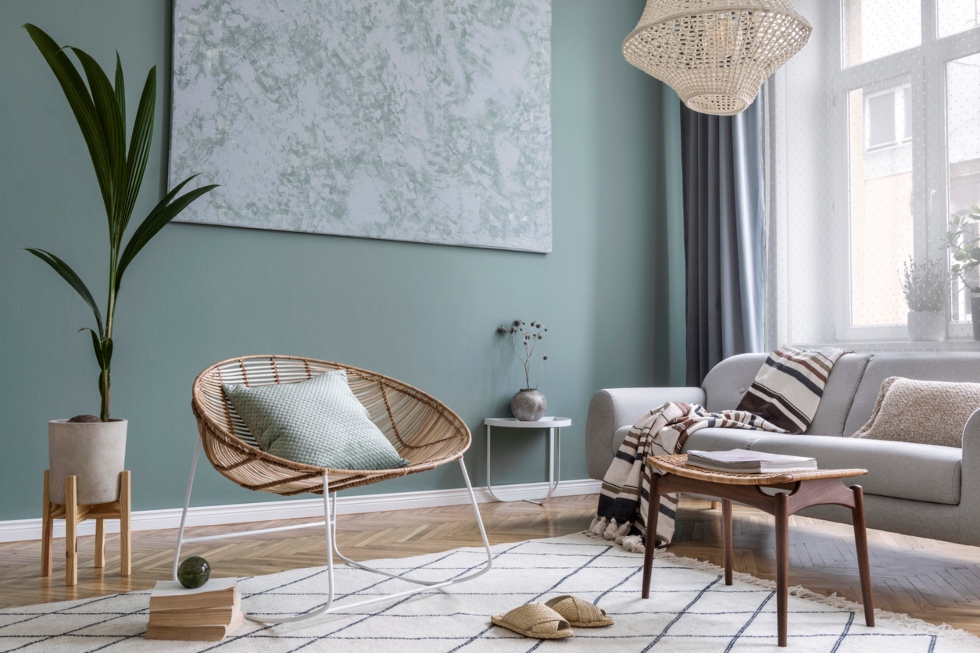 Modern living room with a soft green painted wall